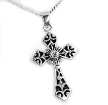 Sterling silver cross pendant with genuine blue topaz stones on top an 18